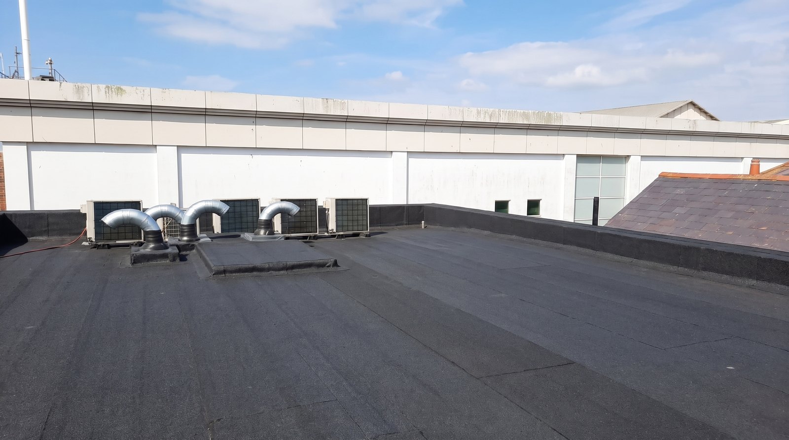 Commercial plant units on a freshly felted roof deck